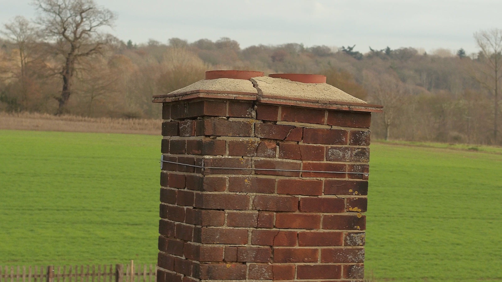 Aerial photography showing extreme close up view of a church roof in Essex