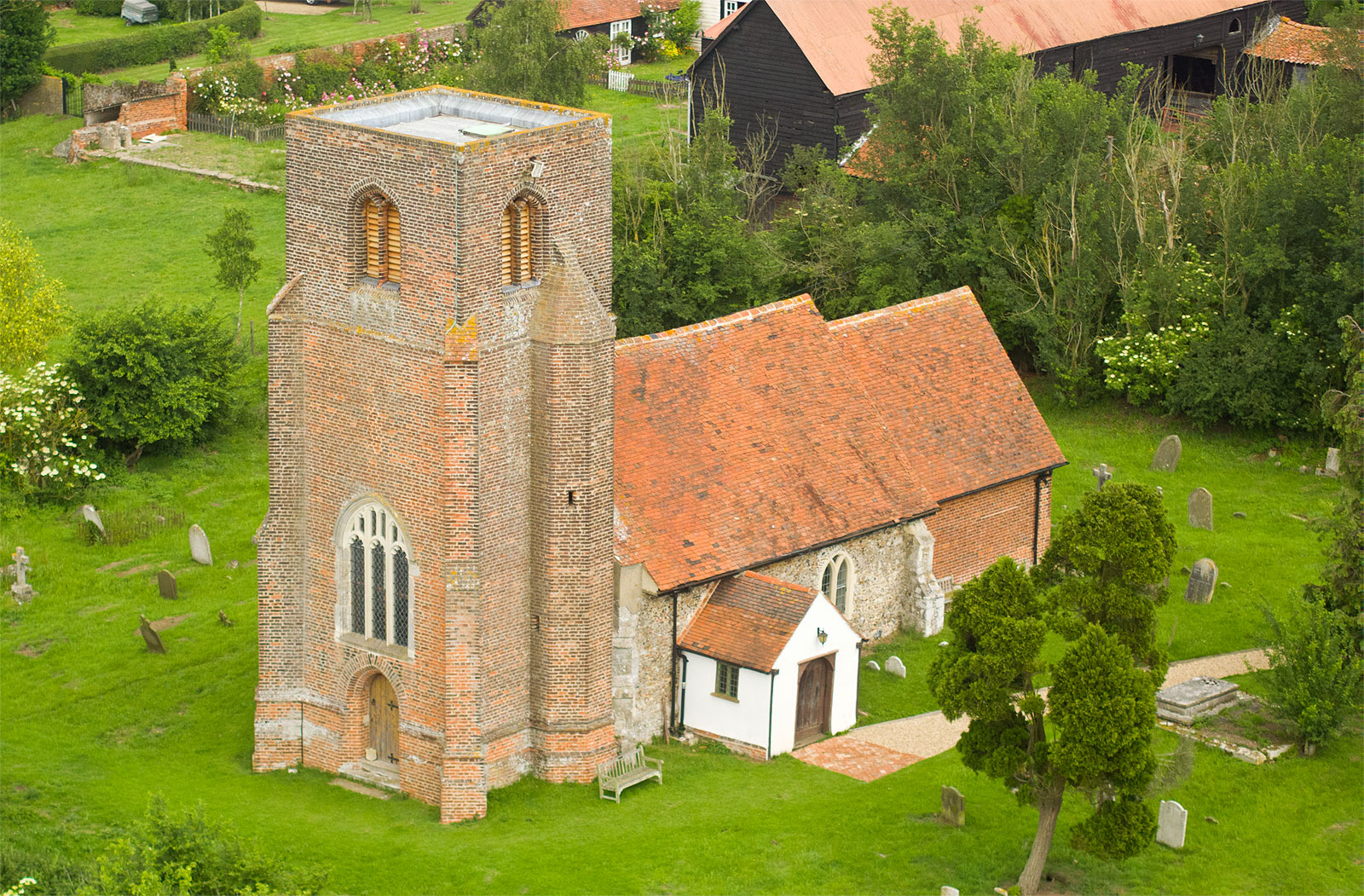 Aerial photograph of historic church in Essex showing the whole structure