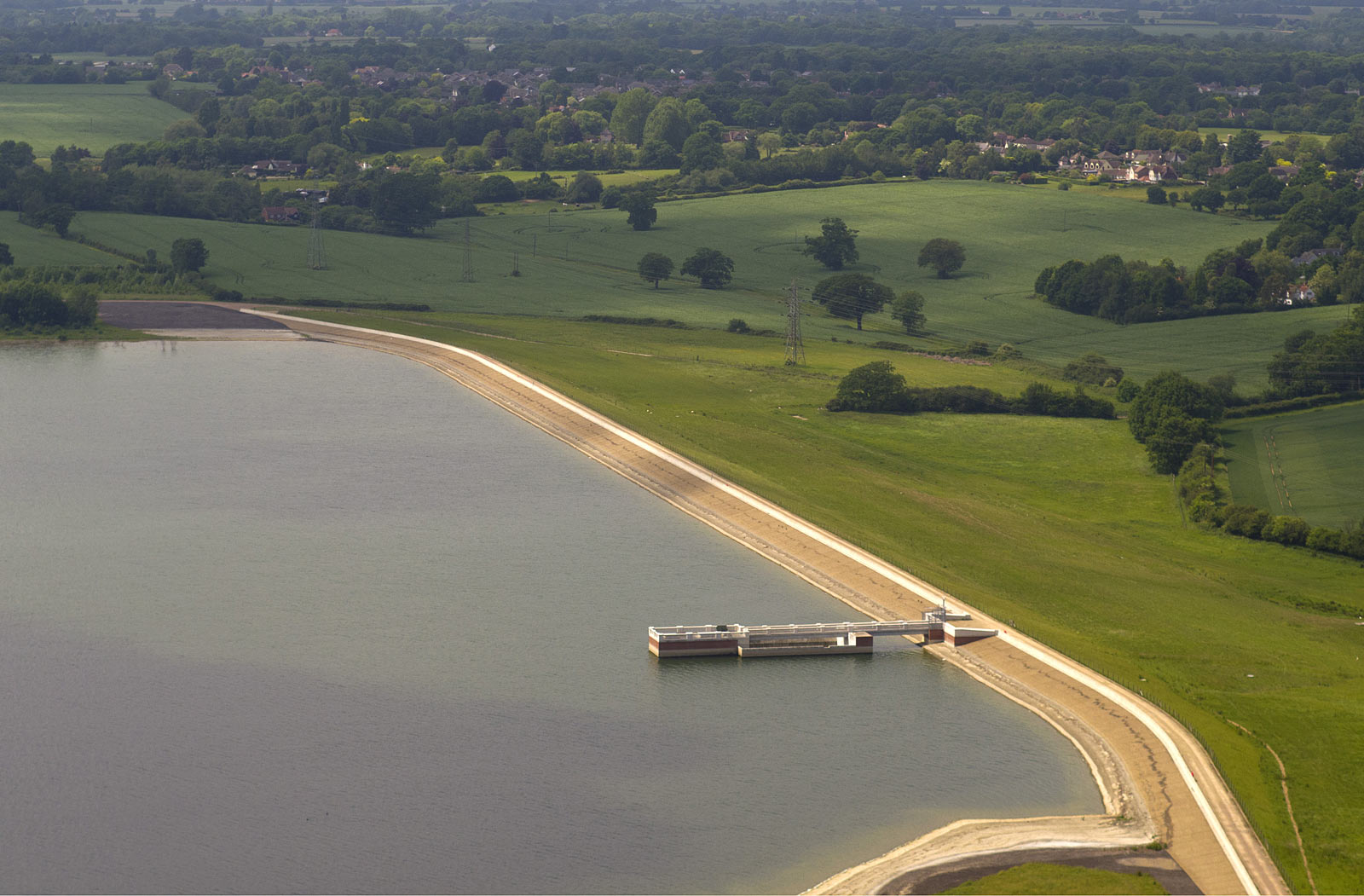 Aerial photograph of reservoir dam showing the whole structure and surrounding countryside